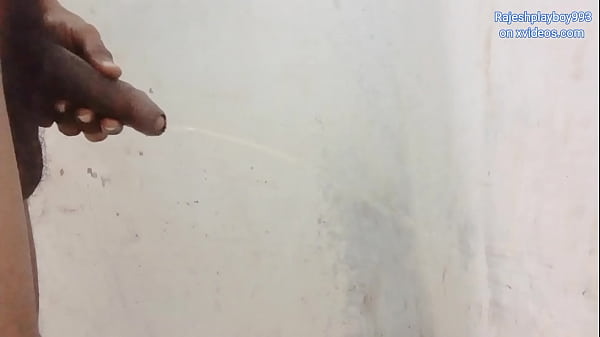 Rajeshplayboy993 pissing in the bathroom